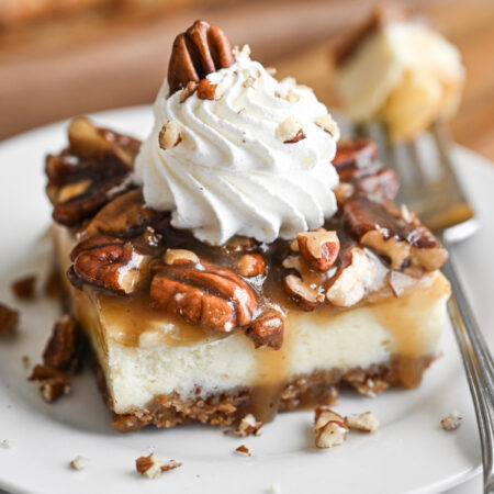 A Pecan Pie Cheesecake Bar on a white plate.