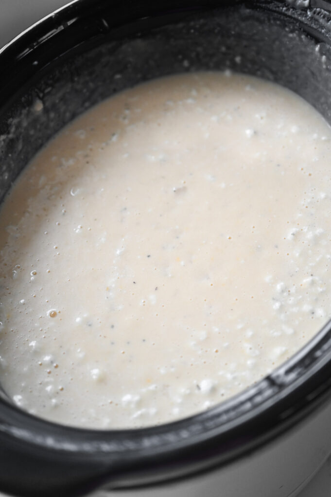 Potato soup in a black crock.