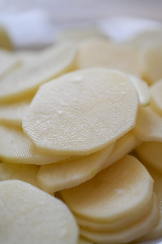A close-up of potato slices, about 1/8 inch each.