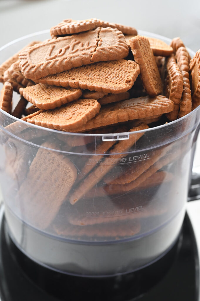 Whole Biscoff cookies in the base of a food processor.