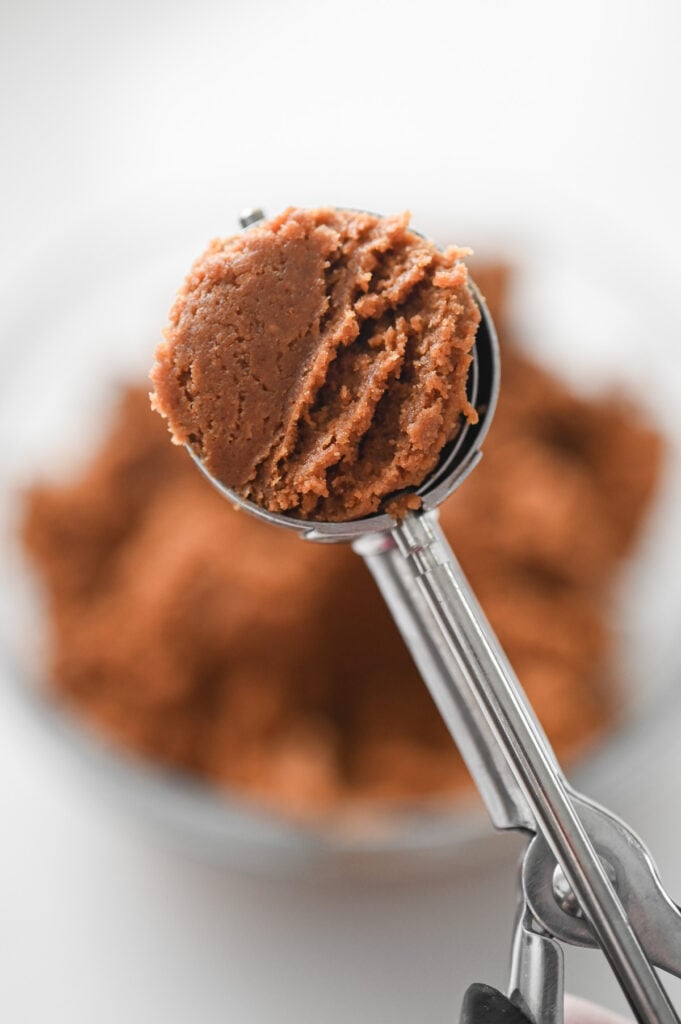 A cookie scoop (2 tsp size) with Biscoff dough in it.