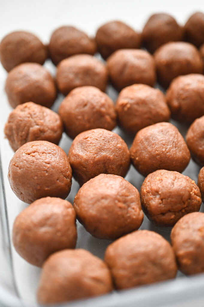 Biscoff truffles in a pan before coating. 