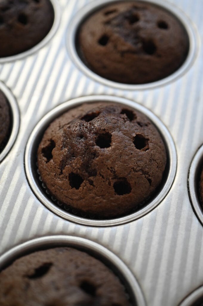 A chocolate cupcake with lots of "pokes" in it.