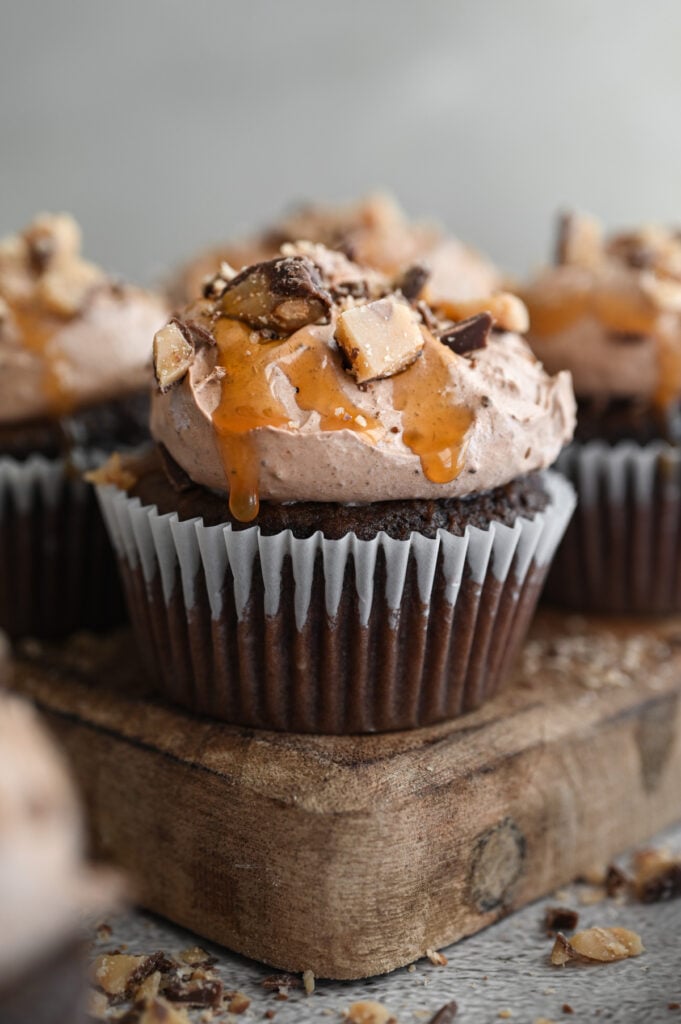 Finished Better Than Anything Cupcakes on a wooden board.