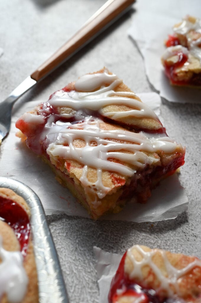 A cherry bar with some backlight showing the shininess of the icing.