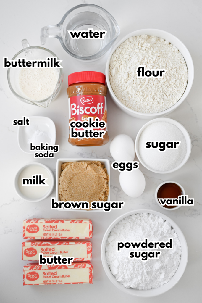 The ingredients needed for Biscoff Cake on a white background.