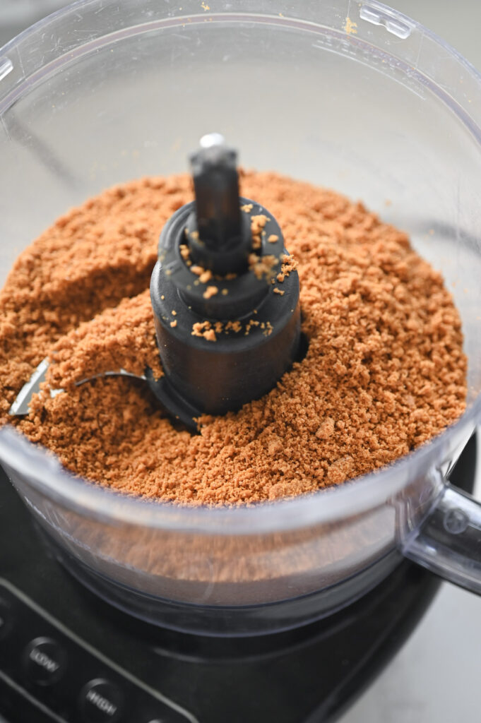 Pulverized Biscoff cookies in a food processor.