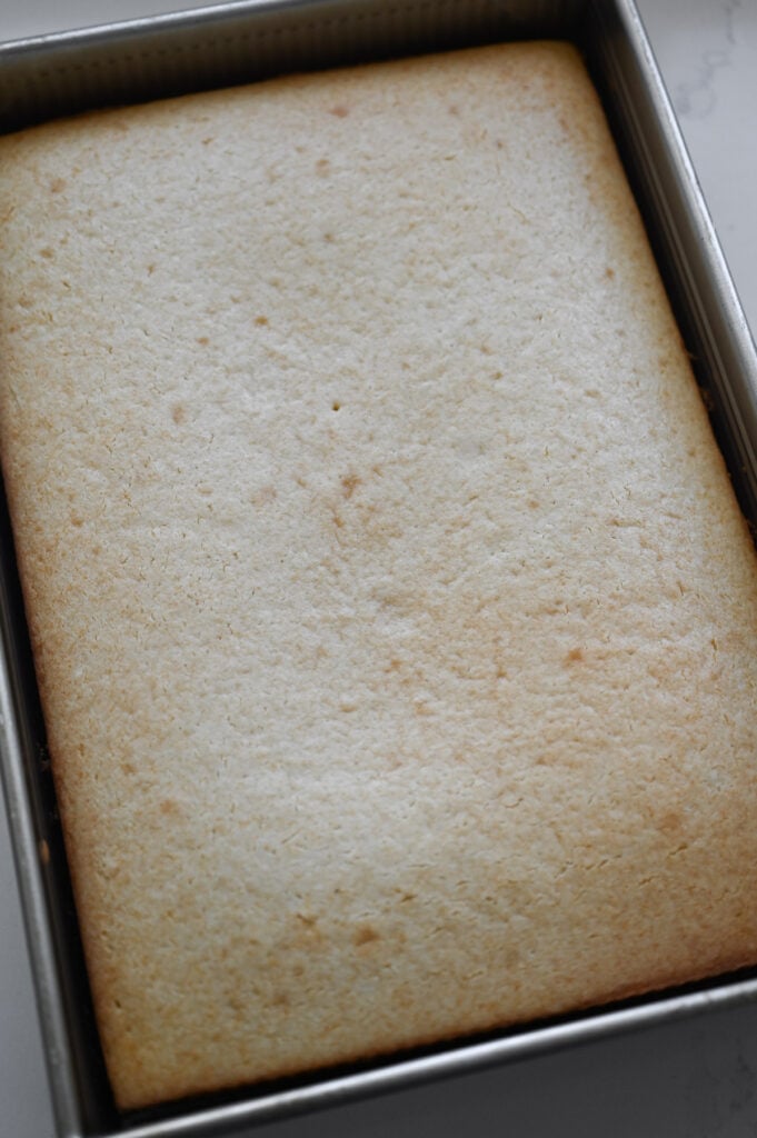 A baked white sheet cake.