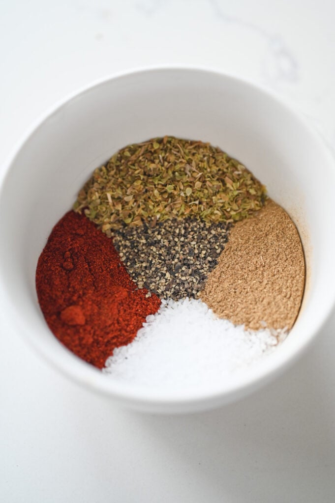 The seasoning ingredients in a little white dish.