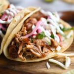 A close-up of a carnitas taco.