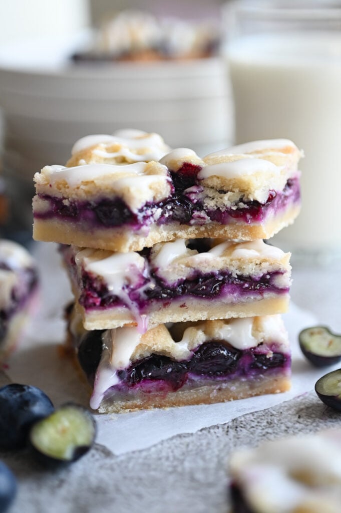 Three blueberry crumb bars stacked up on eachother.
