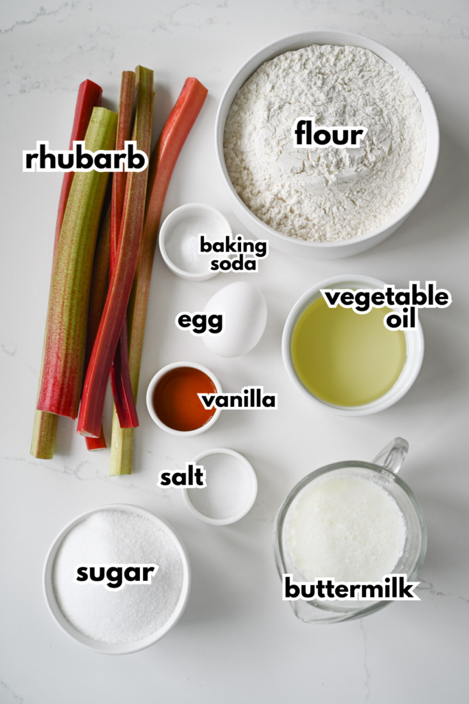 The ingredients needed to make rhubarb bread on a white background.