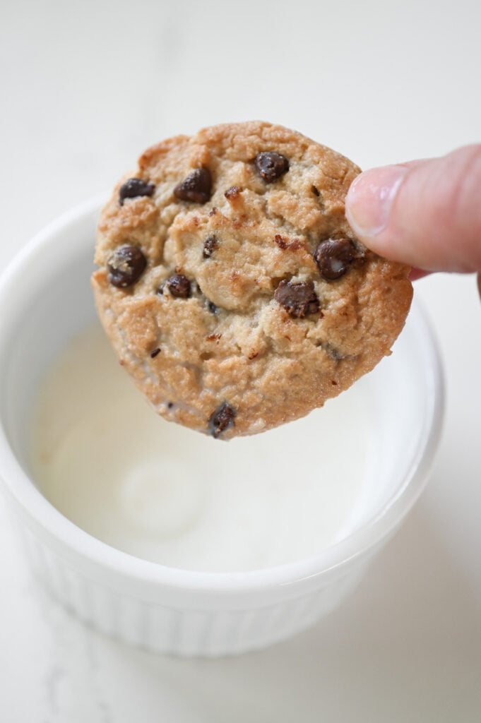 A chocolate chip cookie that's been dunked into milk.