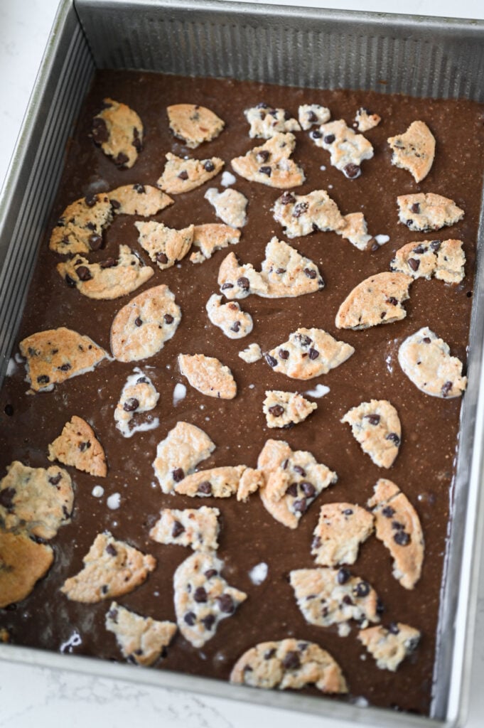Chocolate cake batter and chocolate chip cookies broken and place on top.