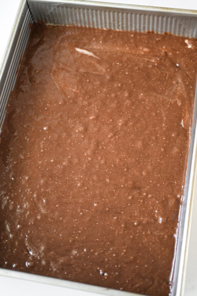 Cake batter in a 9x13-inch pan.