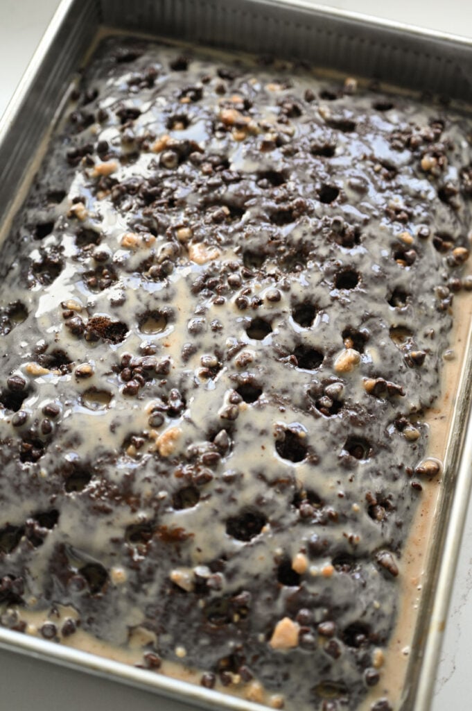 A chocolate poke cake with filling.