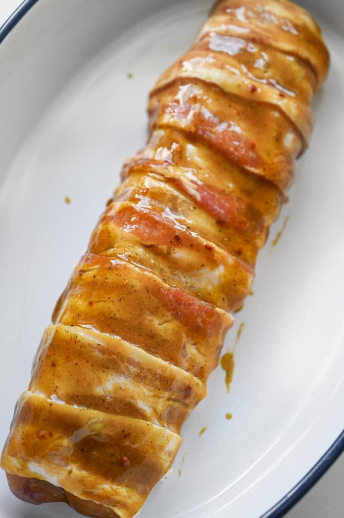 A brown sugar mustard glazed pork tenderloin ready to go into the oven.
