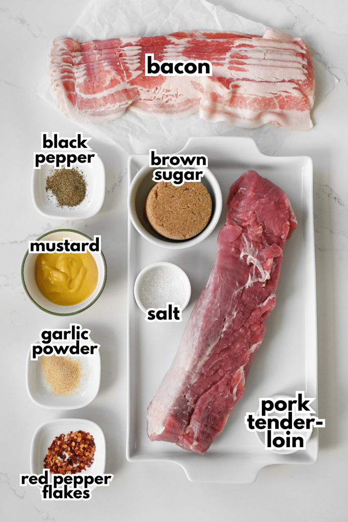 The ingredients needed to make a bacon wrapped pork tenderloin labeled on a white background.